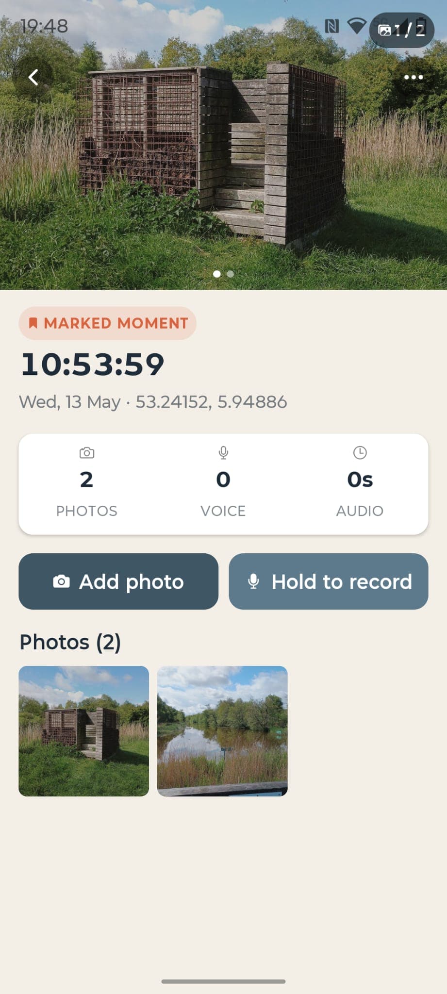 A marked moment in Field Notebook: photo of a bird hide, geo-coordinates, time, and buttons to add photos and record voice notes.